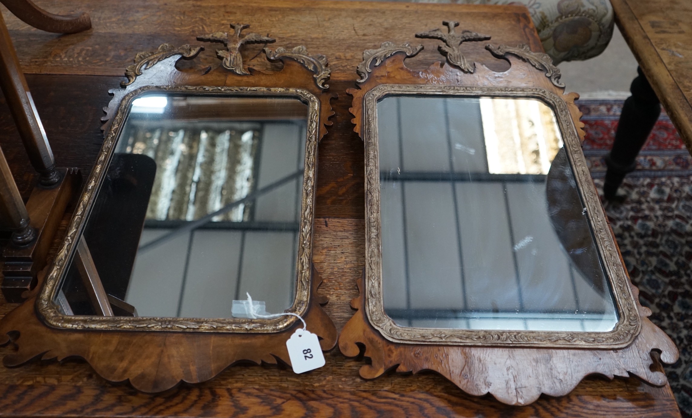 A pair of George III style yew fret cut wall mirrors, width 40cm, height 76cm